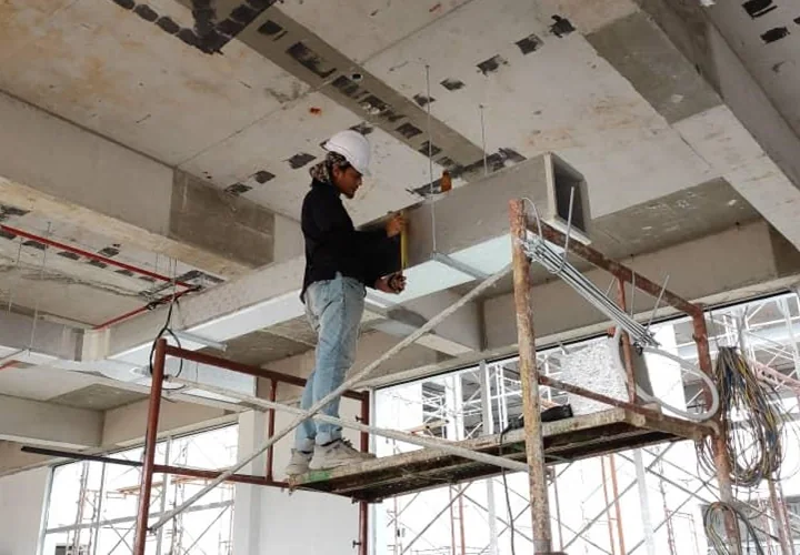 HVAC technician installing pre-insulated ductwork